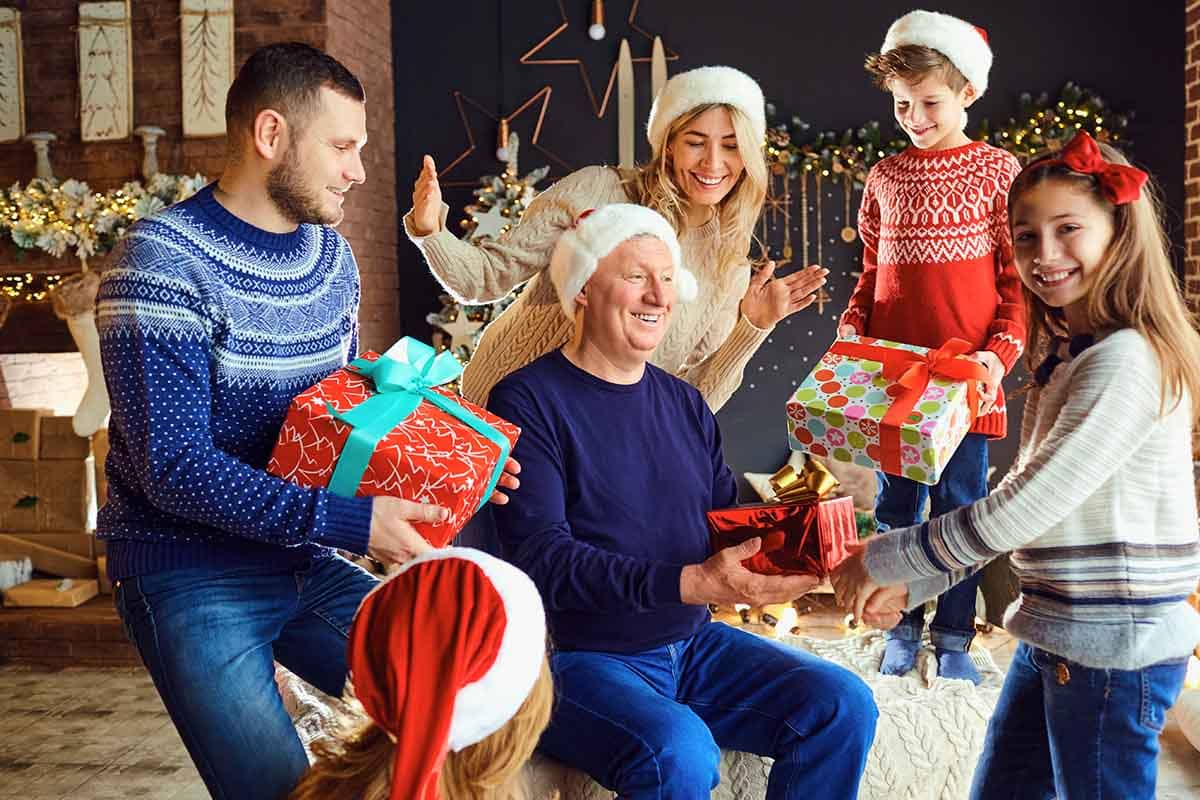 family opening presents together as a sober holiday activity