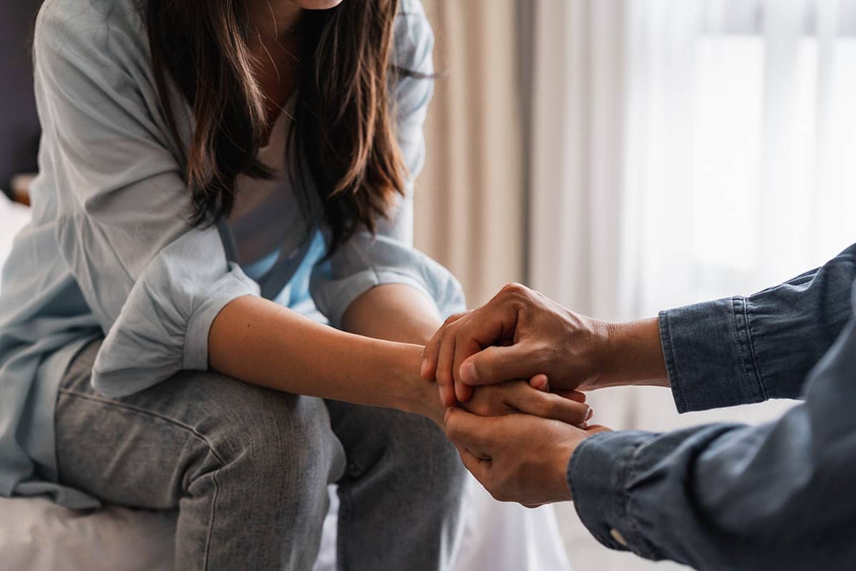 patient and therapist discuss domestic violence and substance abuse