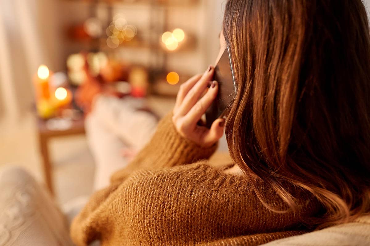 a woman calls her sponsor during a holiday event