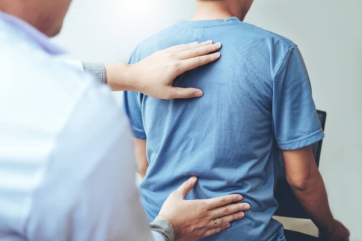 man practicing chiropractic health and wellness