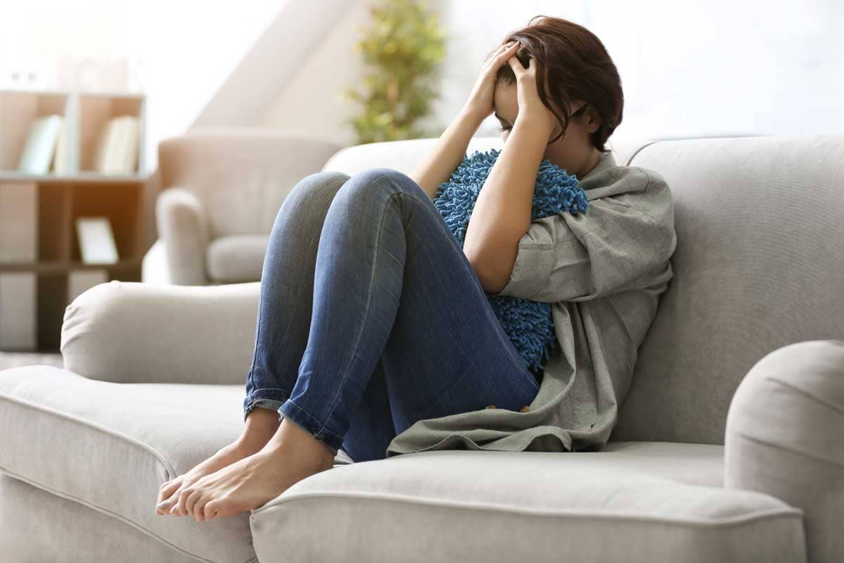 A woman thinking about how much she needs cocaine overdose treatment