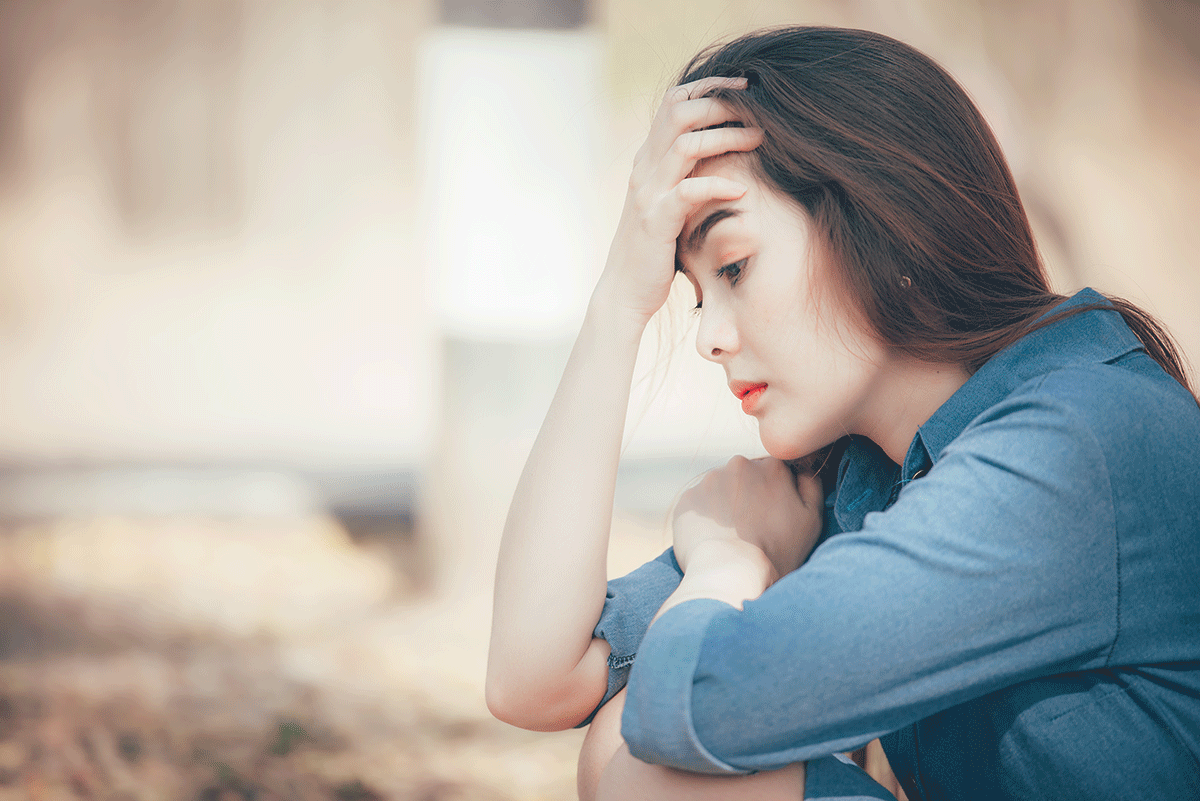 Woman thinking about PTSD symptoms in women