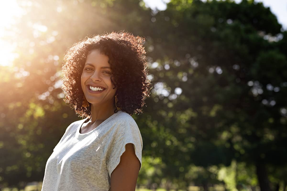 A woman thinking about her success in recovery