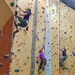 a group climbing at portland rock gym