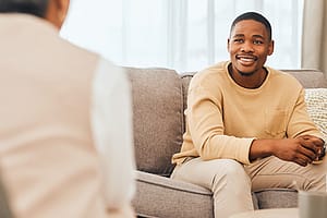 a man talks to a therapist during cocaine addiction treatment