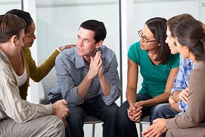 Group of people discussing prescription painkillers addiction