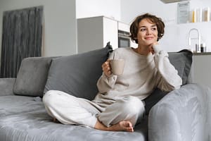 woman sitting on couch