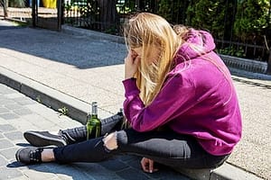 what type of drug is alcohol, this sad girl on the curb is asking