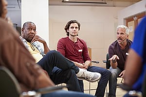 men in group therapy during polysubstance abuse treatment