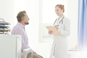 patient with doctor explaining chronic relapse treatment