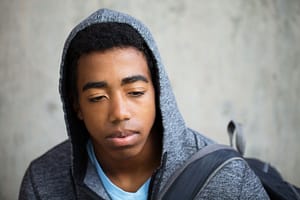 A teen thinking about teen drug use