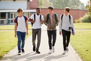 Several teen boys in an alumni program