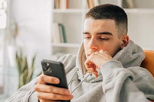 A teen thinking about social media addiction treatment