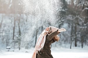 person playing in the snow celebrates mental wellness month