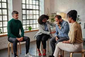 group of people in addiction treatment navigate treatment near them