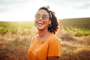 woman smiling while enjoying sobriety