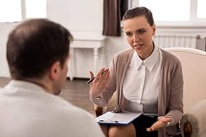 Man chatting with a substance abuse professional about next steps in treatment.