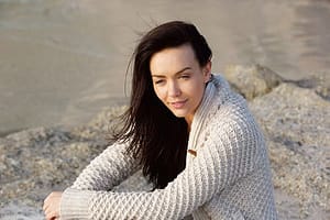 Peaceful woman near water will define detox starting at Tides Edge