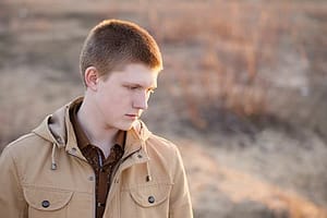 Sad young man worried about the side effects of fentanyl he's experiencing.