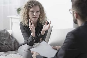 Counselor talking to a young woman about an early intervention program