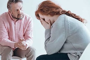 woman sitting in therapy