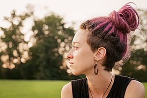 Young woman looking away from lgbtq+ addiction treatment center in Florida