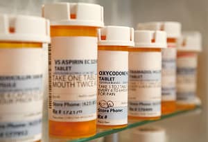 bottles of pills represent prescription drug problem