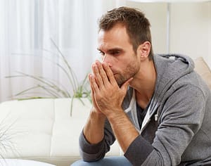 person thinking about symptoms of oxycontin addiction