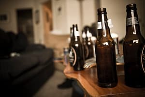 Binge drinking involves lots of alcohol at one sitting-like these beer bottles all lined up.