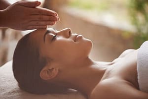 Woman receiving therapeutic massage at rehab center