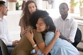 two women hug each other at an alcohol rehab center in atlanta ga