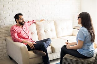 a man talks to his therapist about alternatives to a drug rehab center in atlanta ga