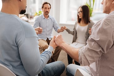 12 step in jacksonville group holding hands in circle