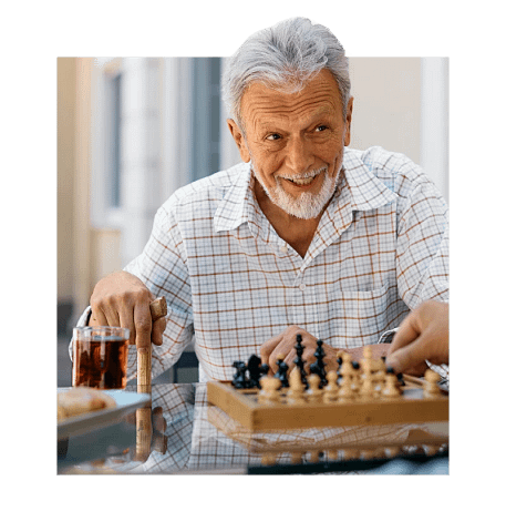 Senior playing chess