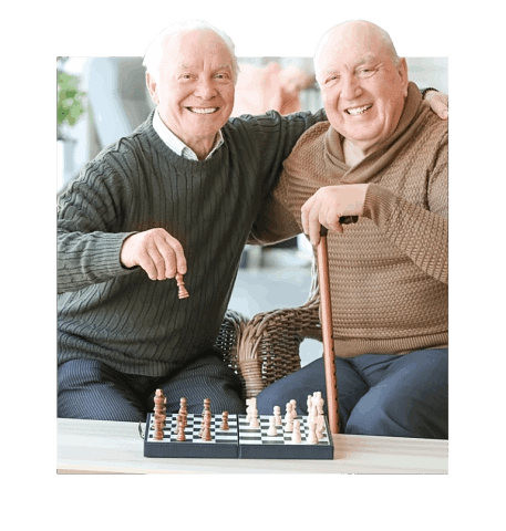 Seniors smiling playing chess