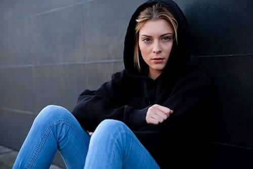 young woman in black hoodie has heroin side effects