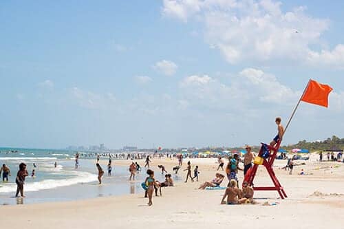 Wide shot of beachgoers on a Jacksonville Beach