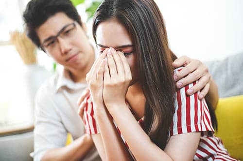 someone comforting loved one with drug addiction