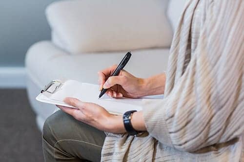 Woman filling out paperwork