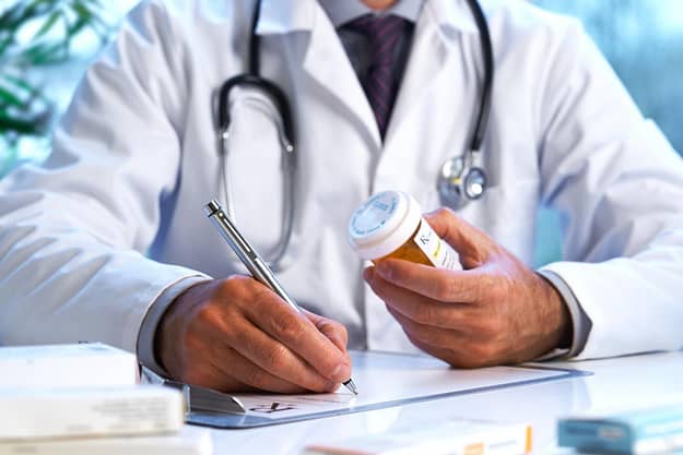 A doctor authoring facts about prescription drugs