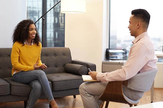 woman talking with therapist getting alcohol help