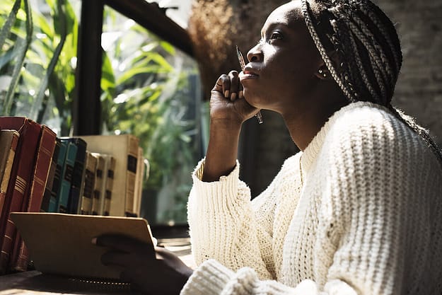 woman using a book to learn how to deal with depression