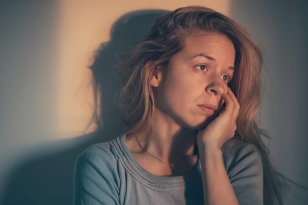 woman distraught about cycle of addiction