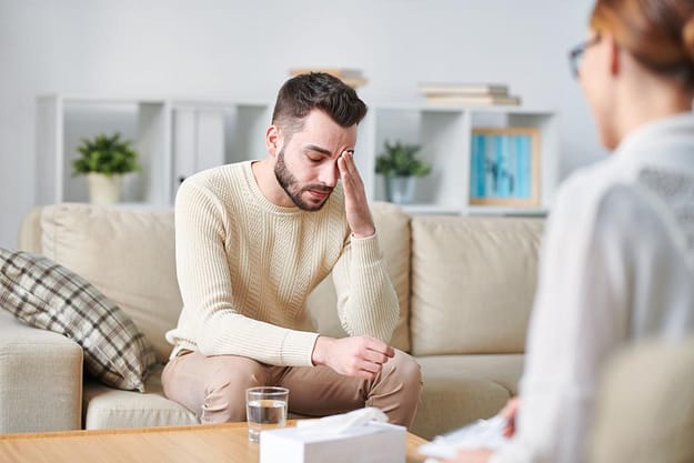 man looking frustrated while going through rapid detox