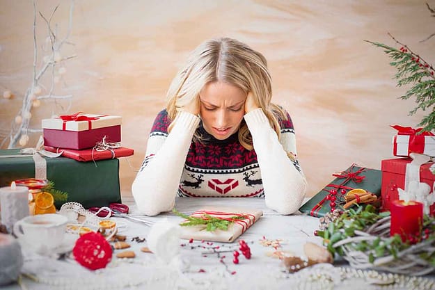 women leaning on her hands during the holidays