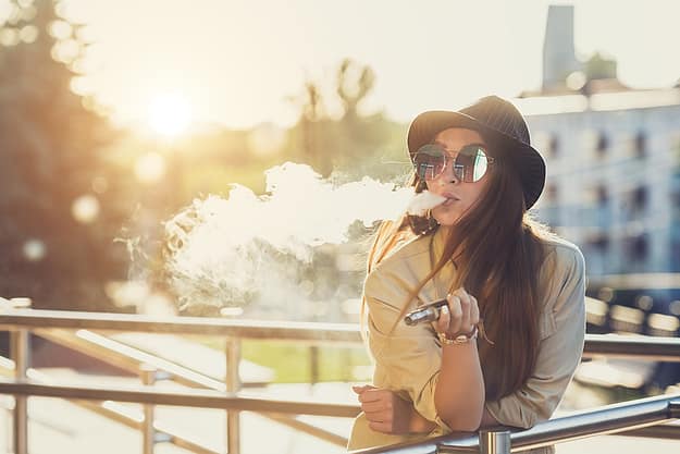 Woman who is unaware of the dangers of vaping marijuana