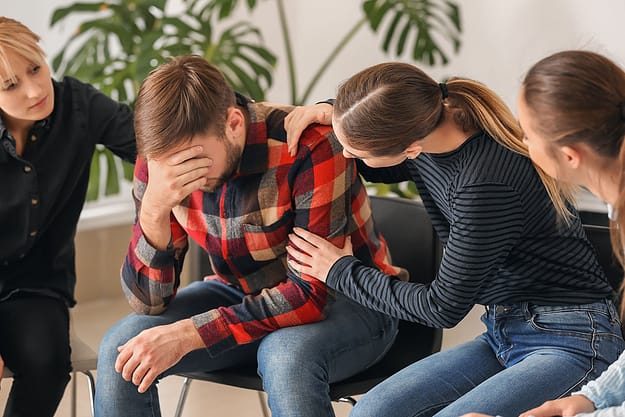 man experiencing the benefits of addiction group therapy