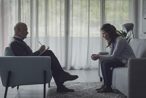 woman talking to male therapist