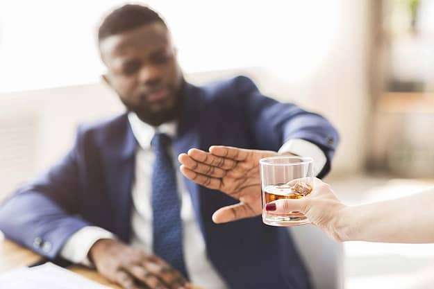 man refusing alcoholic drink after successful alcohol addiction detox treatment in florida