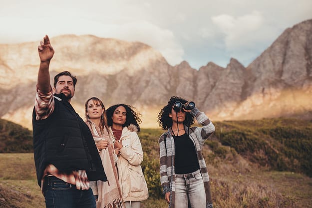 a group going on a hike in the mountains during Adventure Therapy